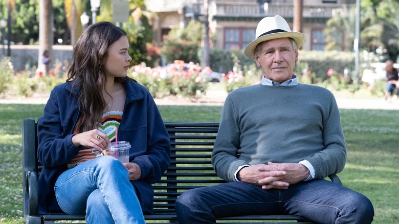 Harrison Ford sits on a bench with Alice on the Apple TV series "Shrinking"